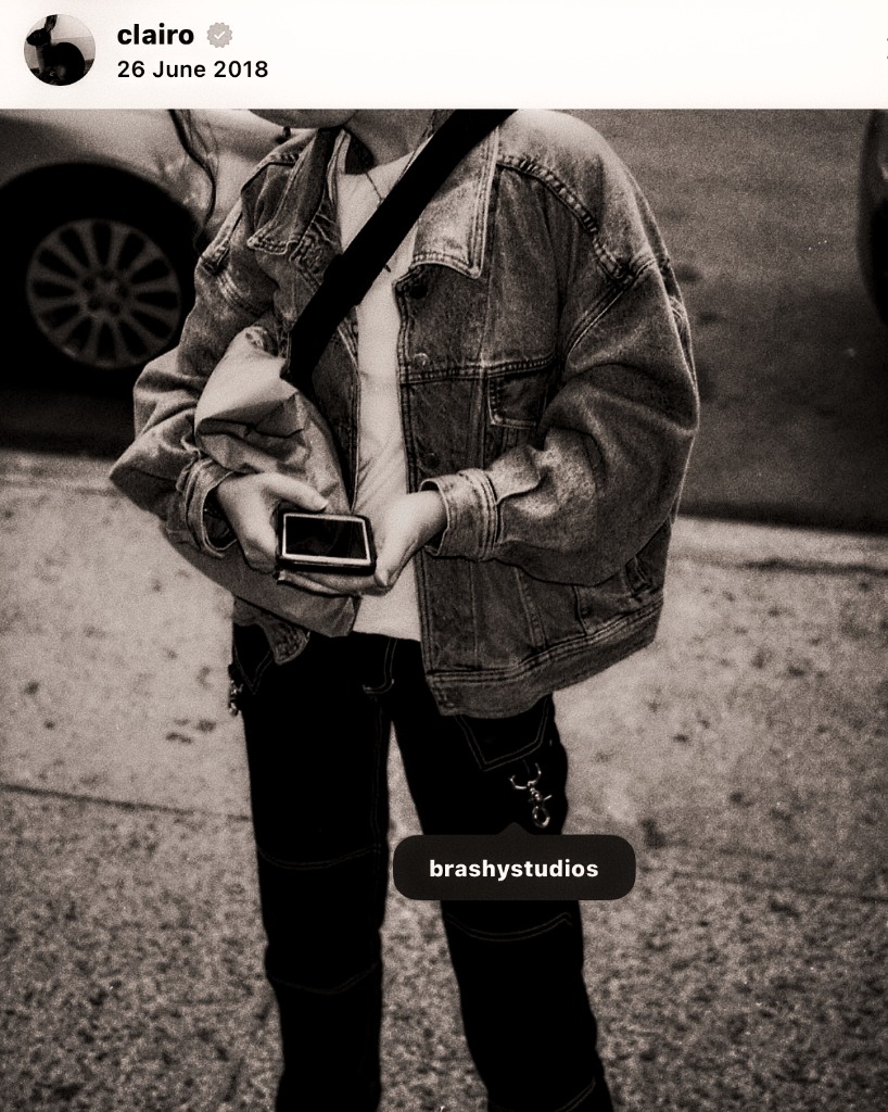 Clairo wearing tagged Brashy Studios contrast-stitched trousers.