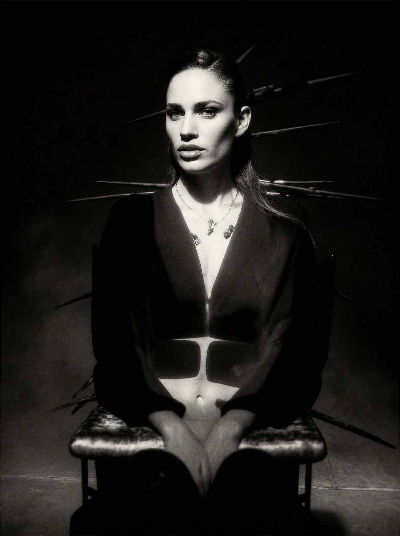 NIIA — gothic chiaroscuro portrait: deep low-key light, the artist held in the gothic pole.