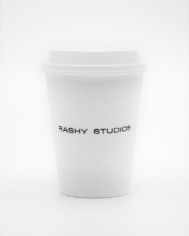 Brashy Studios — chapter one. A model holding a branded cup in the Los Angeles loft.